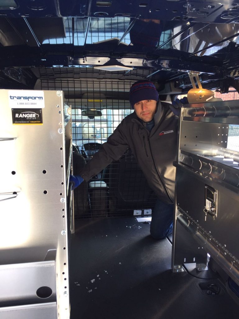 Bryce Ferrie professional locksmith inside his Alpha Locksmith van used for emergency locksmith work